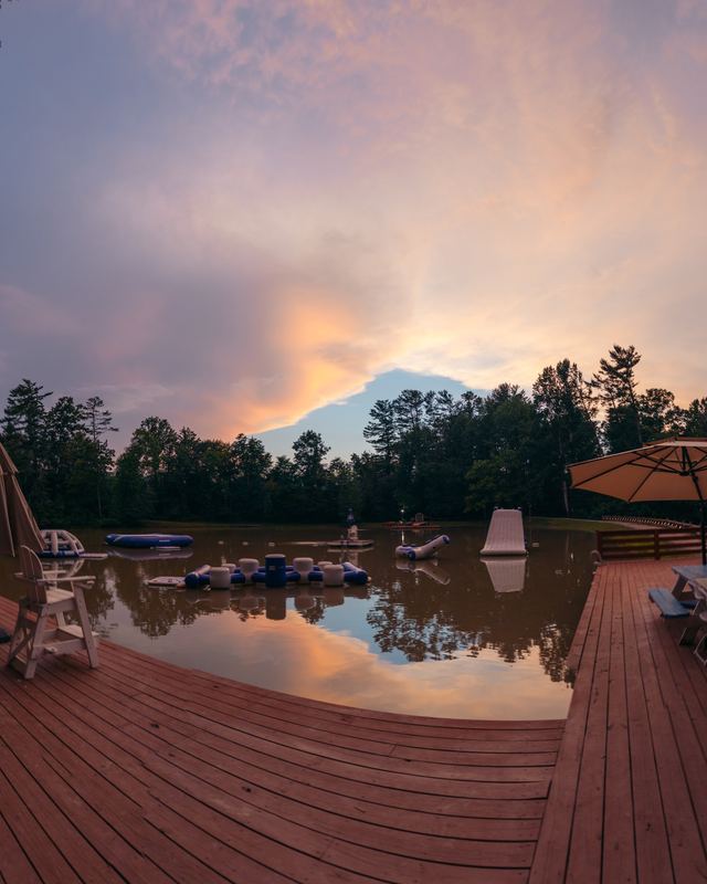 An empty deck over the lake at sunset