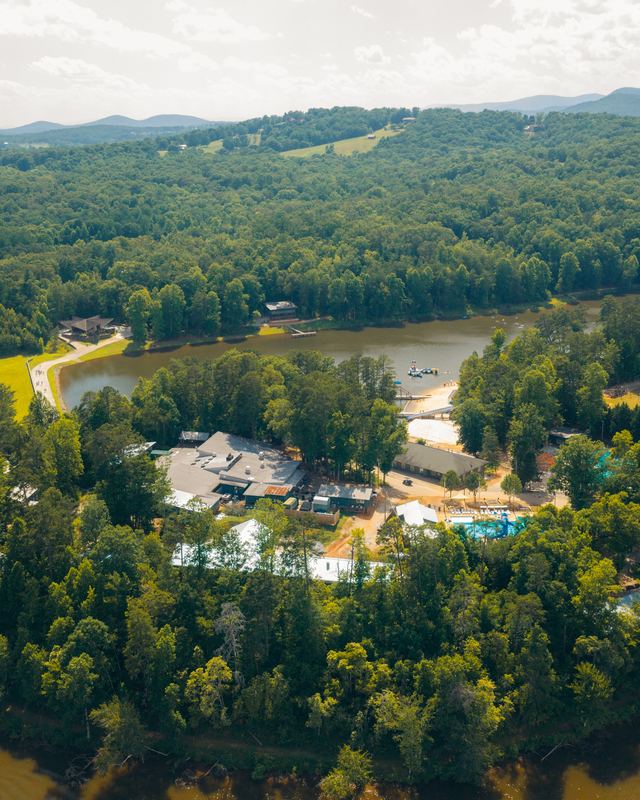 A camp on a lake in the forest, seen from the air