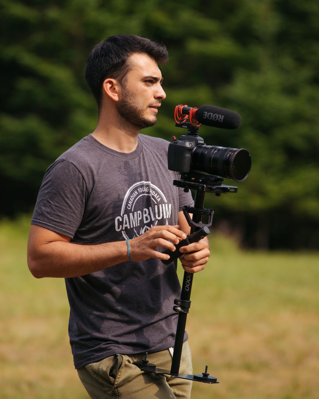Omer filming at camp with a stabilized camera rig